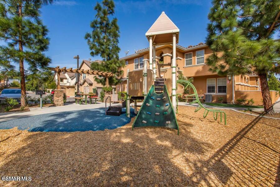 1654 Heywood Street, Unit D Simi Valley, CA 93065 - Photo 14 of 14 a view of a yard with cars