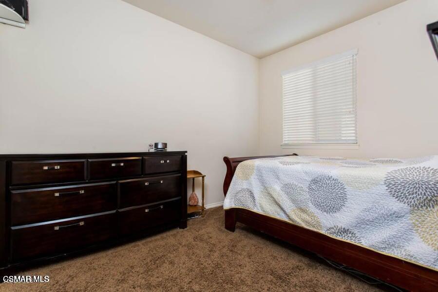 1654 Heywood Street, Unit D Simi Valley, CA 93065 - Photo 8 of 14 a bedroom with a bed and a dresser