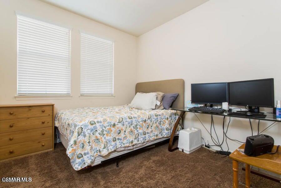 1654 Heywood Street, Unit D Simi Valley, CA 93065 - Photo 9 of 14 a bedroom with a bed and a television