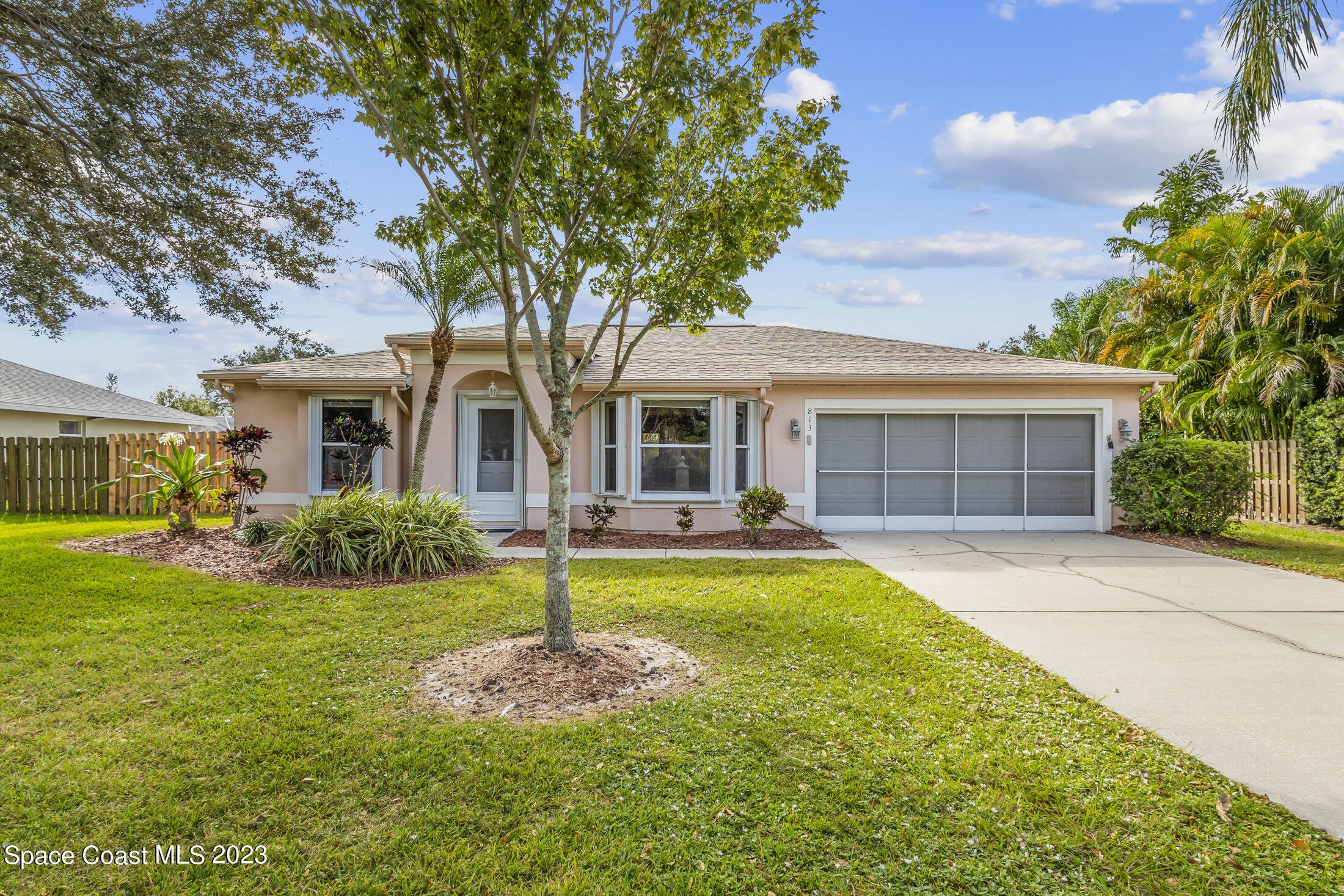 813 Cebu Place Melbourne, FL 32940 - Photo 1 of 25 a front view of a house with swimming pool having outdoor seating