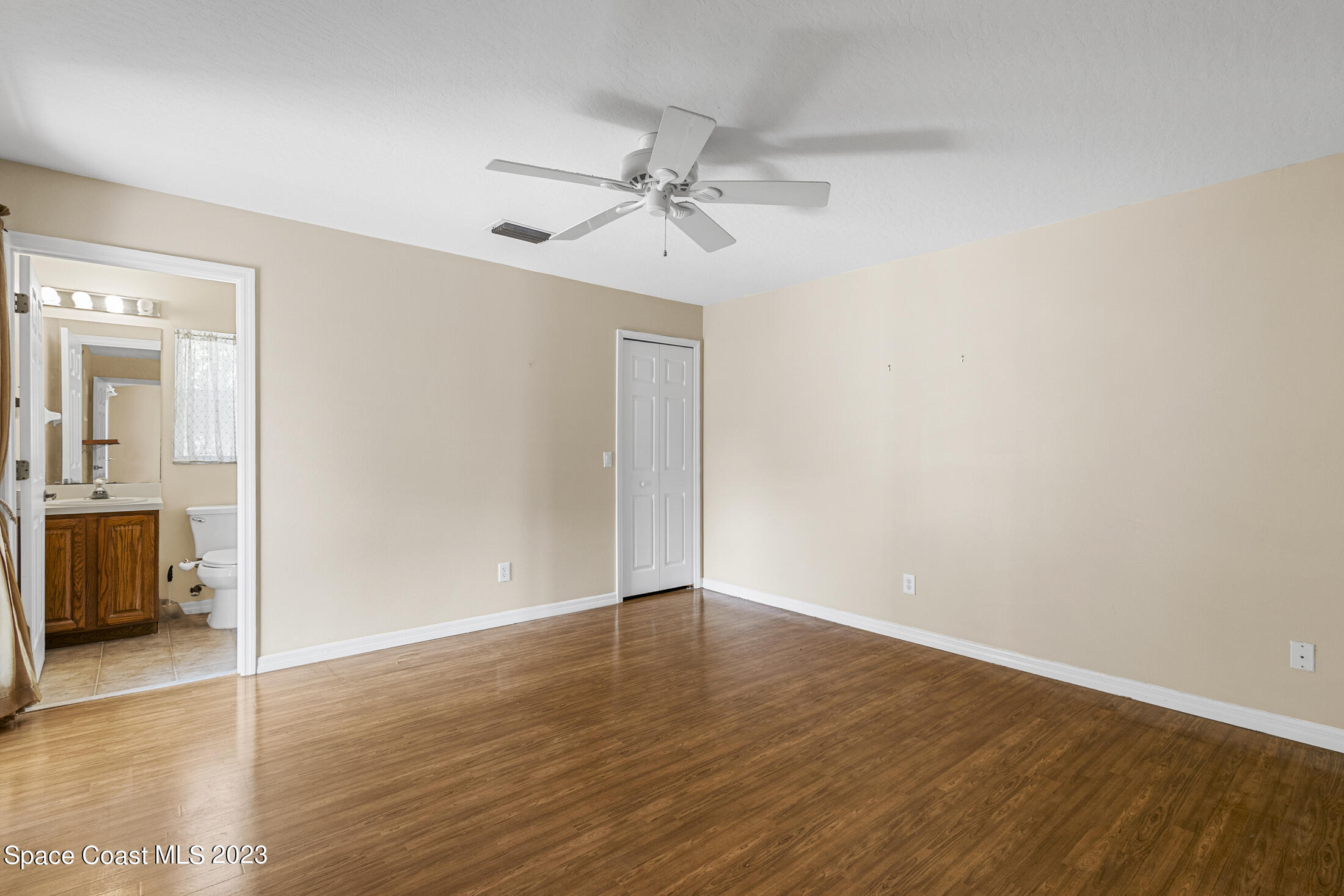813 Cebu Place Melbourne, FL 32940 - Photo 15 of 25 wooden floor in an empty room