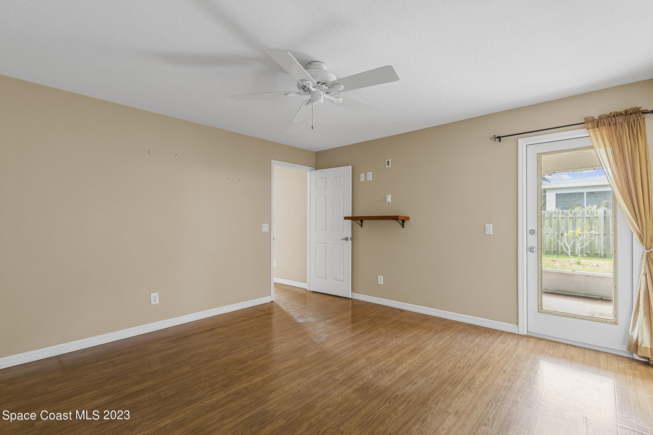 813 Cebu Place Melbourne, FL 32940 - Photo 16 of 25 a view of an empty room with a window