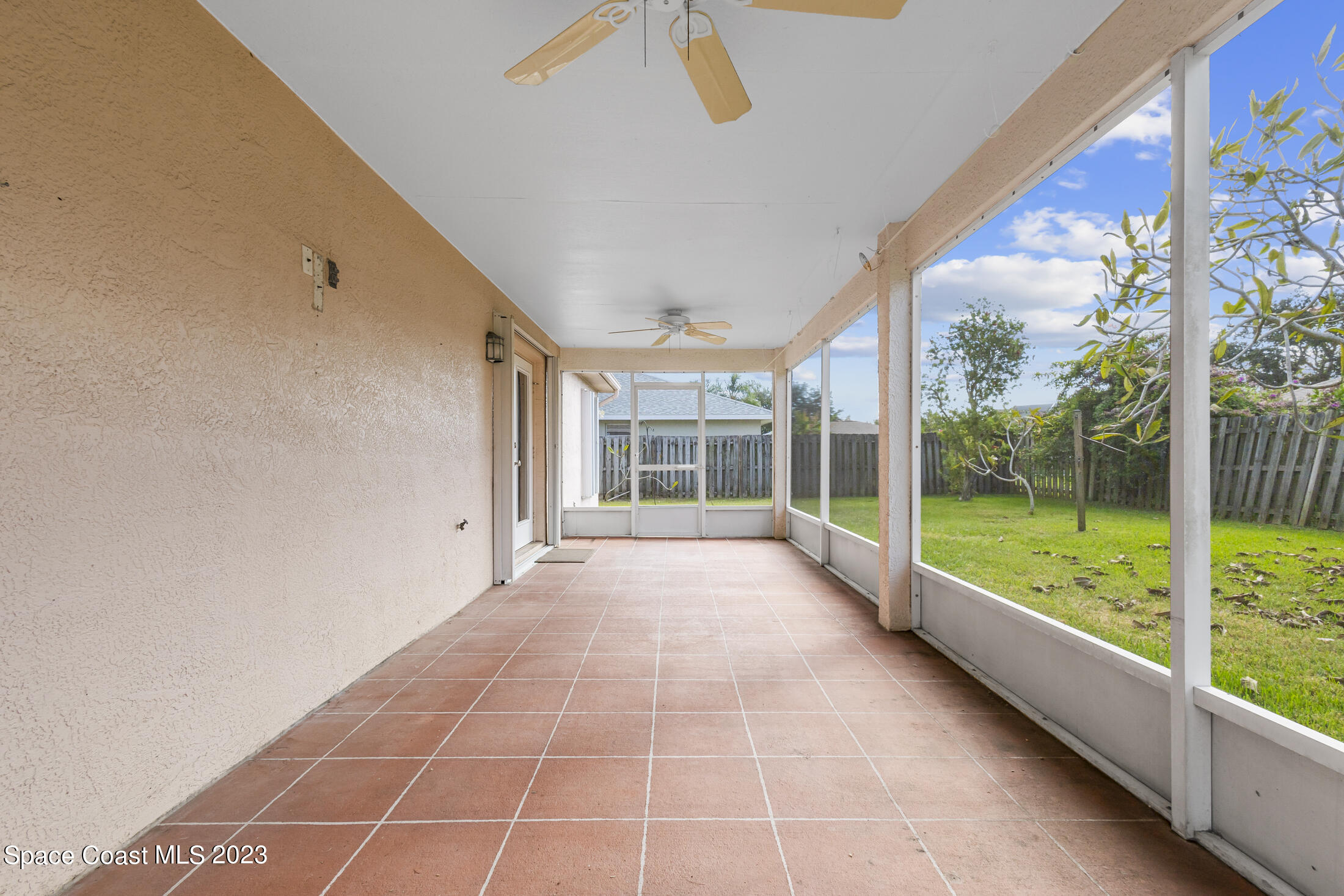 813 Cebu Place Melbourne, FL 32940 - Photo 21 of 25 a view of an empty room with a large window with outer view