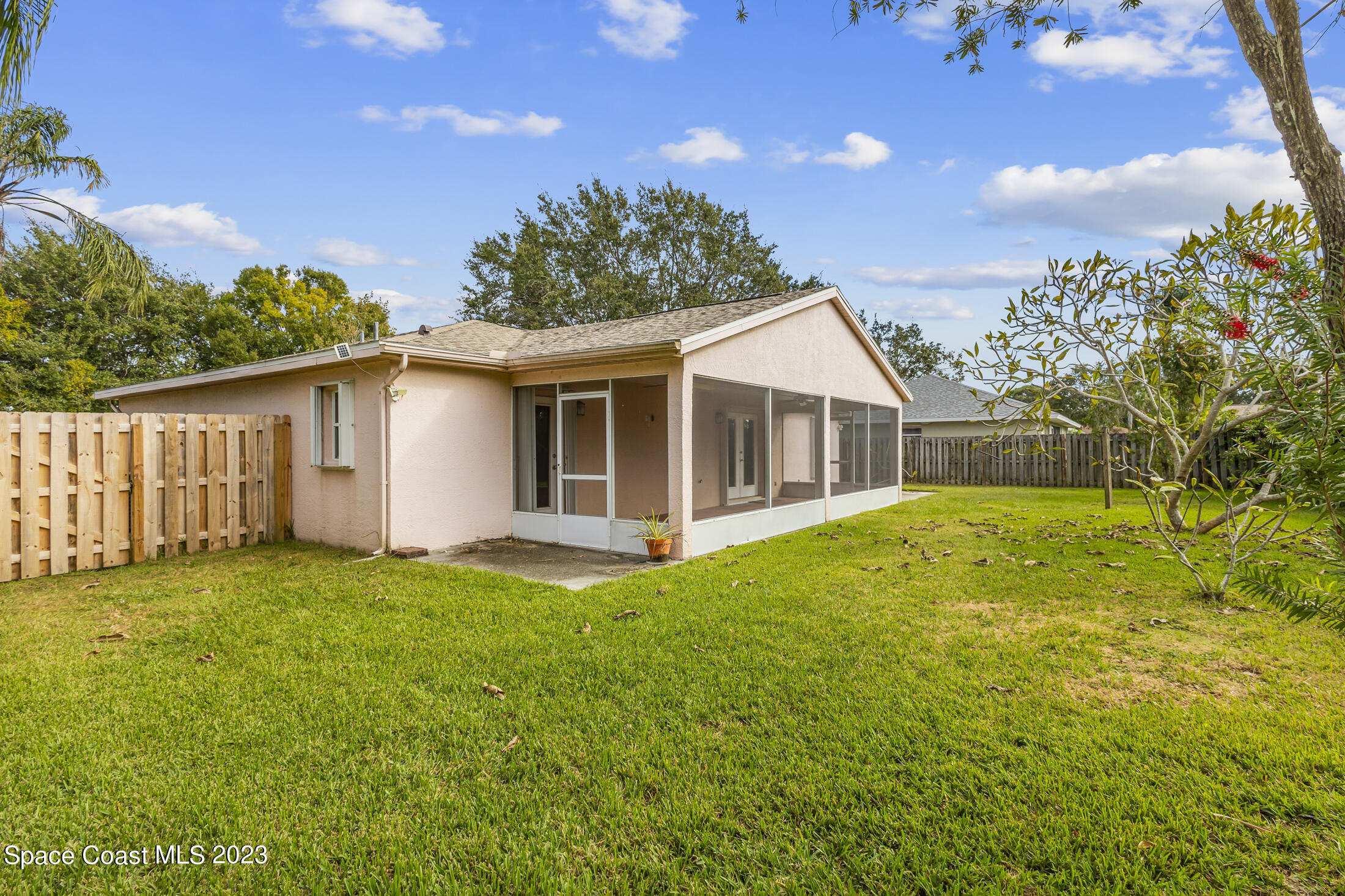813 Cebu Place Melbourne, FL 32940 - Photo 22 of 25 a view of a house with backyard and garden