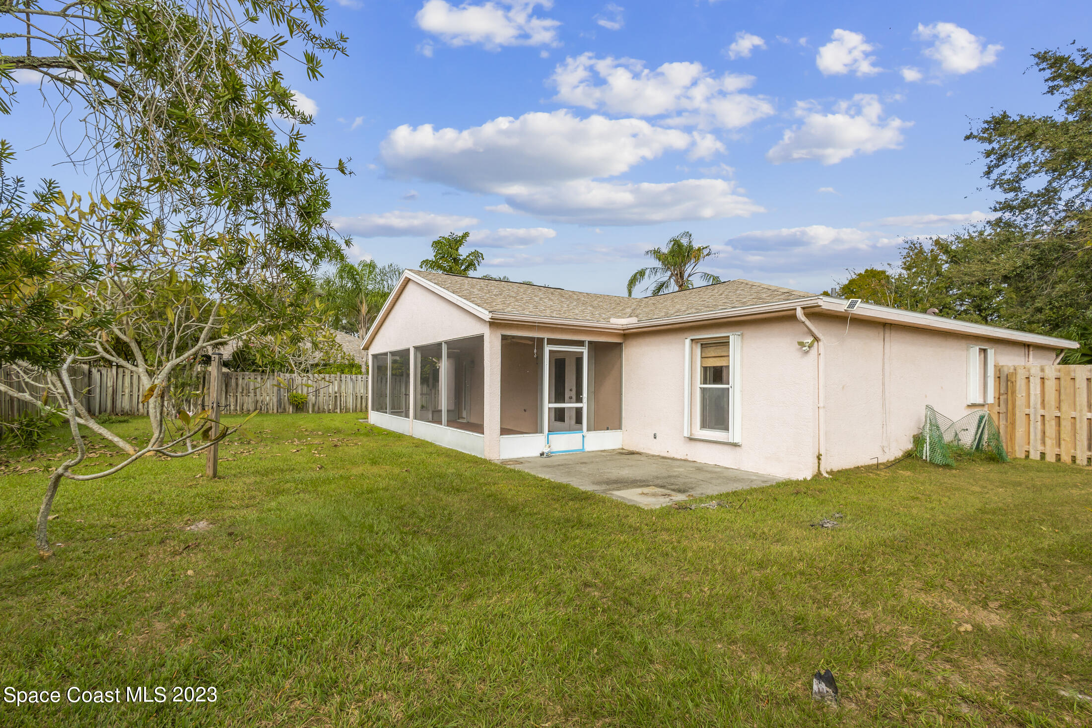 813 Cebu Place Melbourne, FL 32940 - Photo 23 of 25 a front view of house with yard and green space