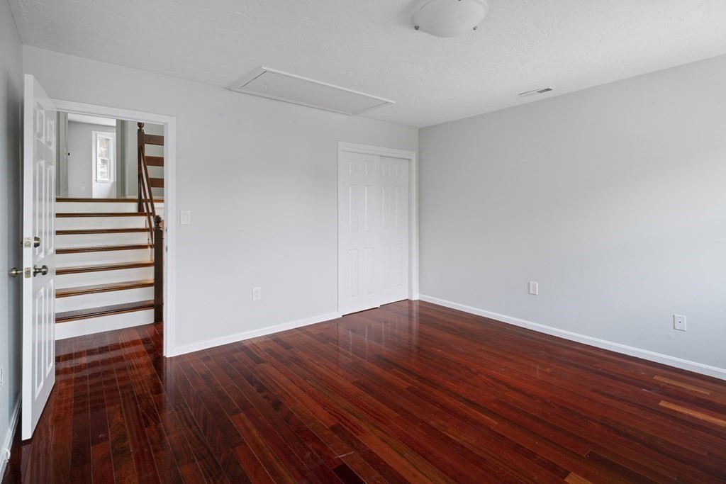 68 Regent Circle, Unit 68 Brookline, MA 02445 - Photo 13 of 21 a view of empty room with wooden floor