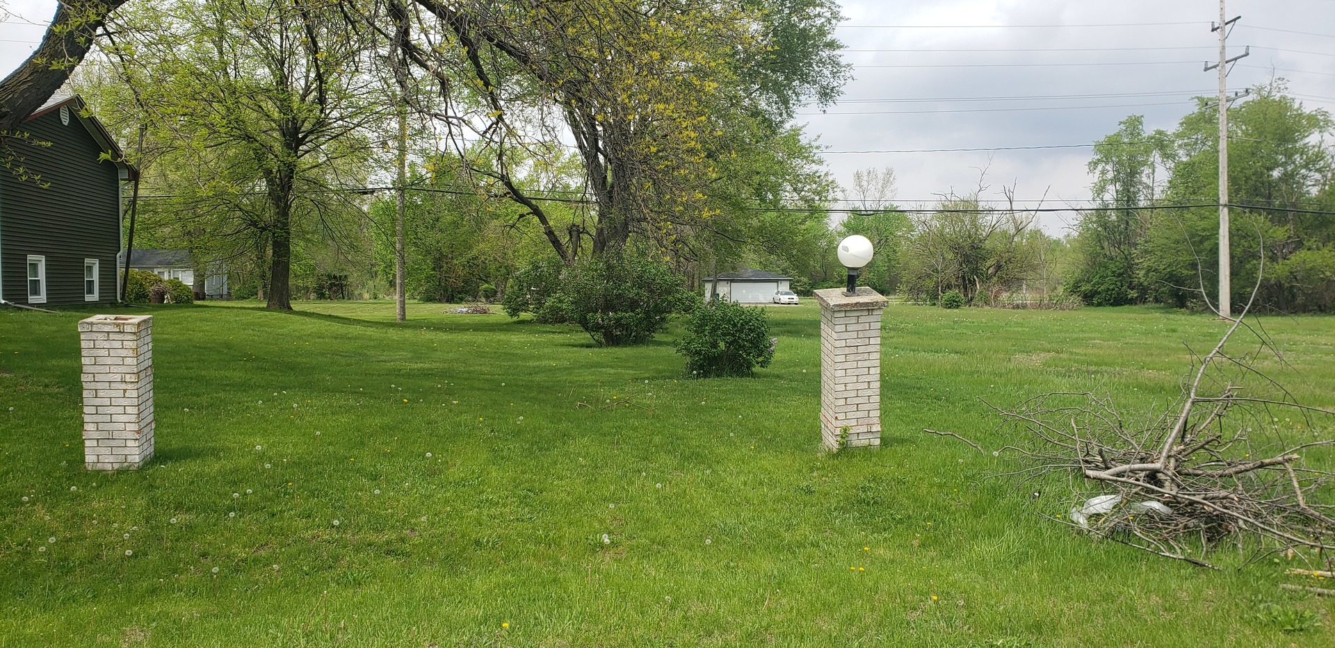 -block 40 East Lot 52 Road Sun River Terrace, IL 60964 - Photo 1 of 1 a street view with tall trees