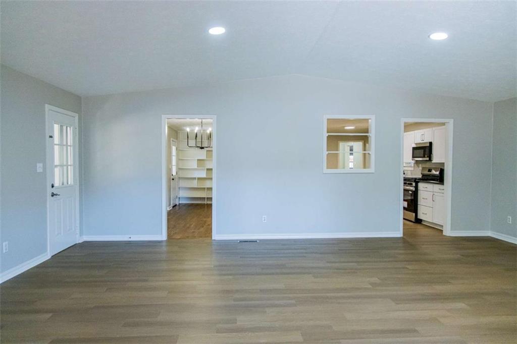 83 Manning Lake Road Rome, GA 30165 - Photo 13 of 26 a view of empty room with wooden floor