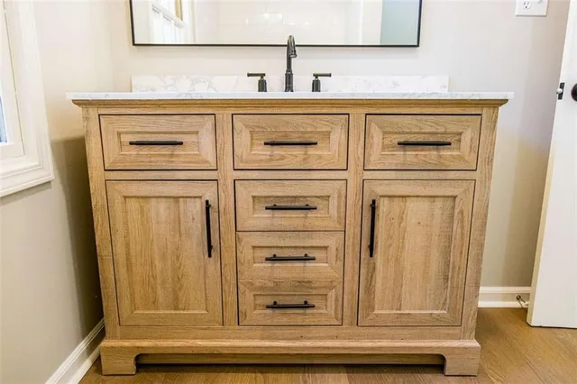 a bathroom with a sink and a mirror