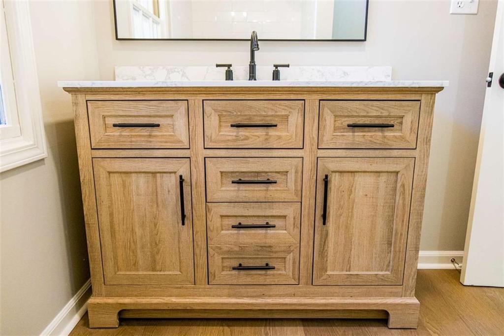 83 Manning Lake Road Rome, GA 30165 - Photo 19 of 26 a bathroom with a sink and a mirror