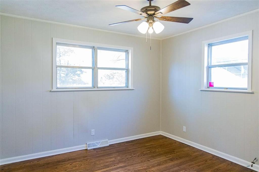 83 Manning Lake Road Rome, GA 30165 - Photo 26 of 26 a view of an empty room with wooden floor and a window