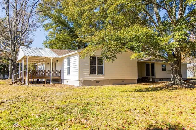 a house with trees in front of it