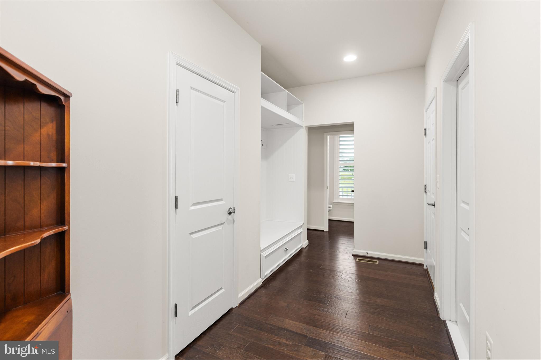 10135 Fast Colors Lane Berlin, MD 21811 - Photo 15 of 63 a view of an empty room with wooden floor and closet