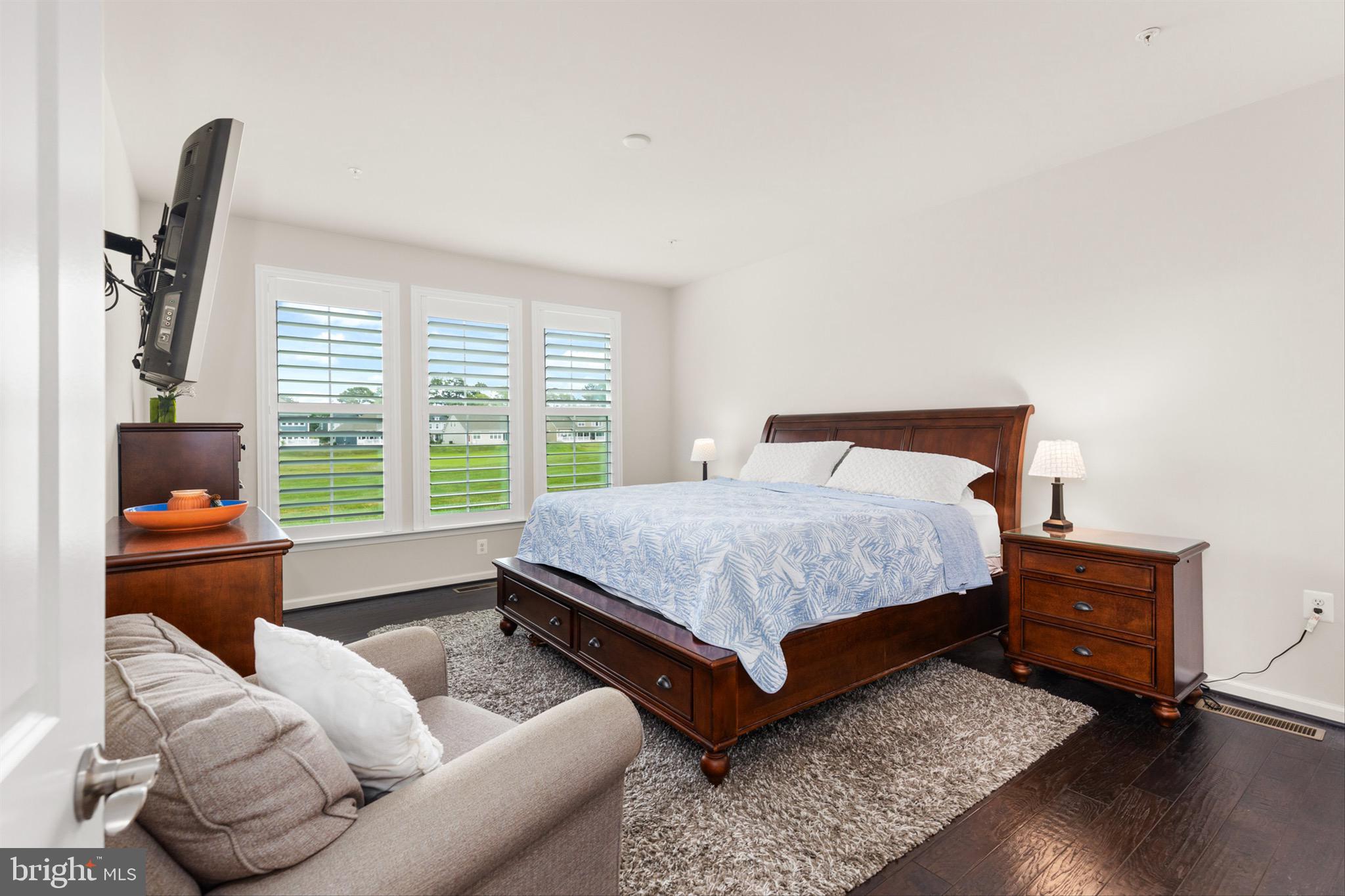 10135 Fast Colors Lane Berlin, MD 21811 - Photo 23 of 63 a bedroom with furniture and a window