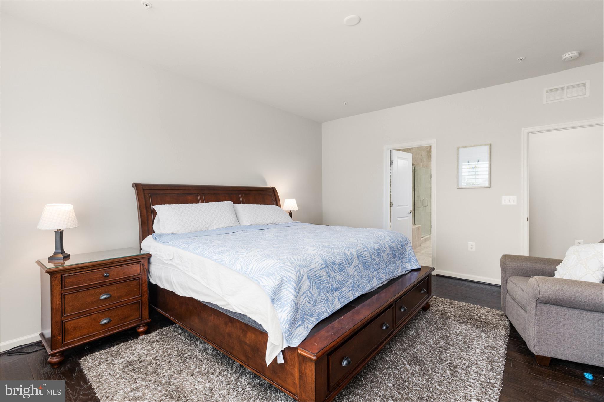 10135 Fast Colors Lane Berlin, MD 21811 - Photo 24 of 63 a bedroom with a bed and a couch