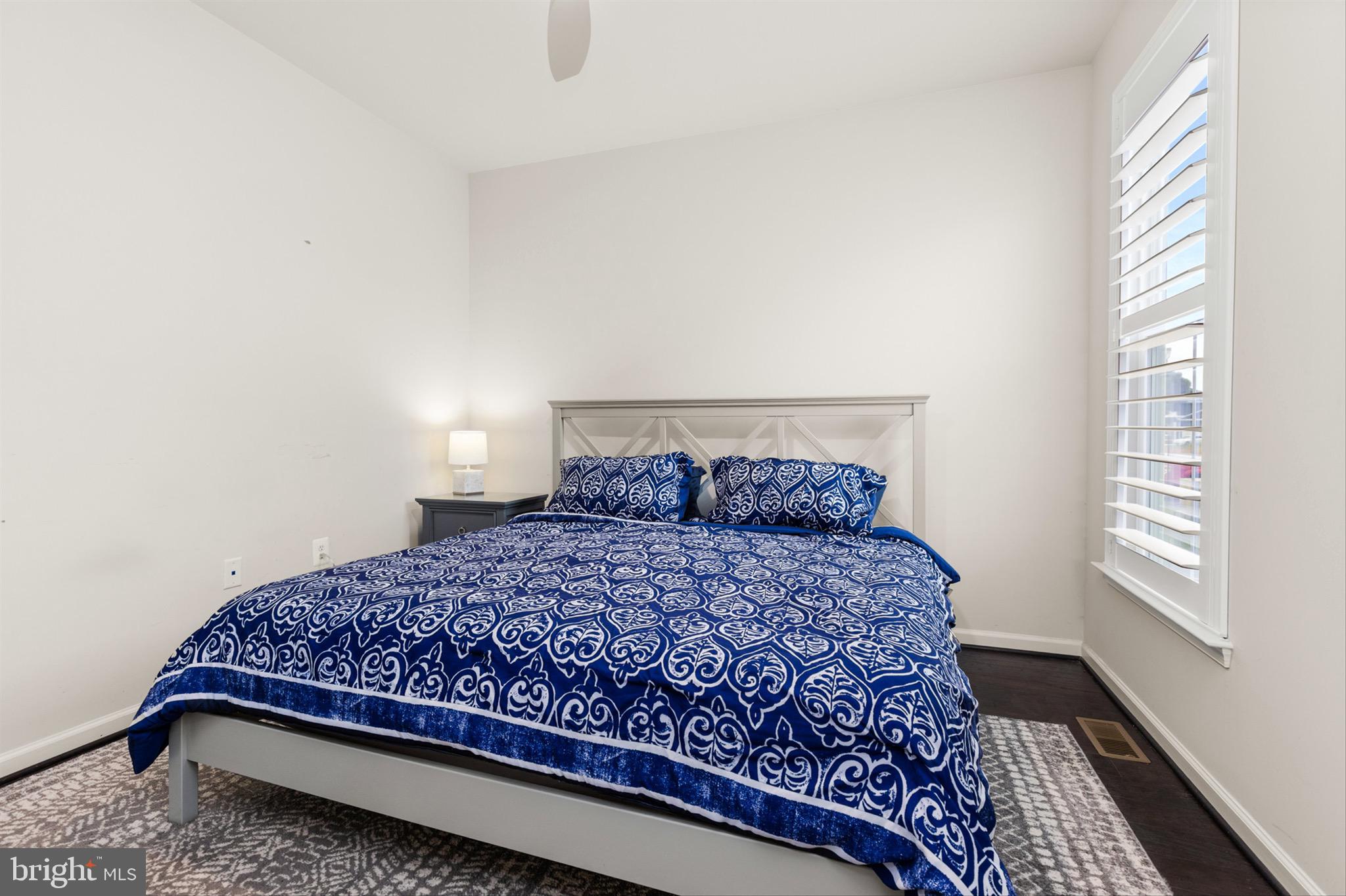 10135 Fast Colors Lane Berlin, MD 21811 - Photo 31 of 63 a large bed sitting in a bedroom next to a window