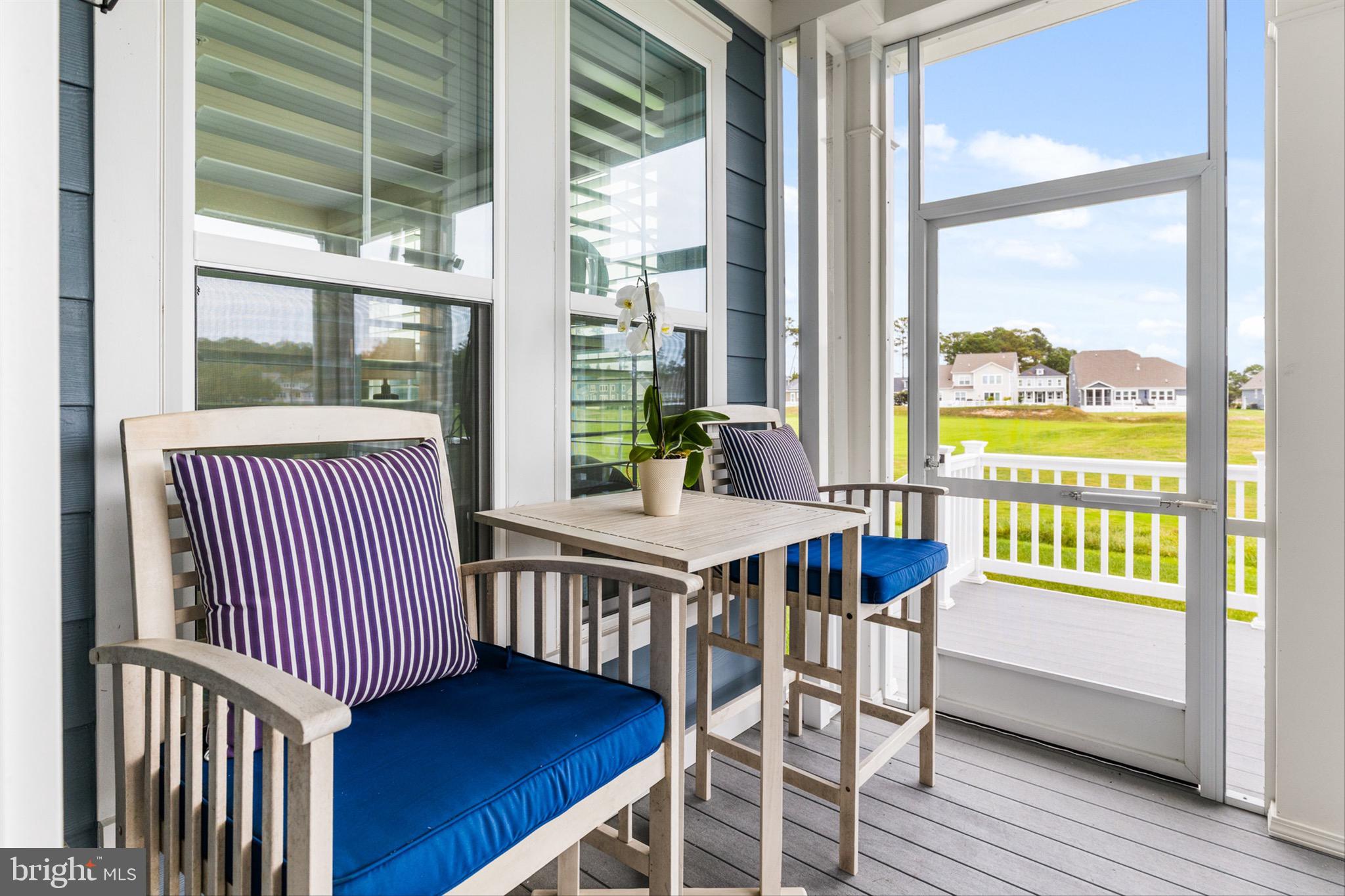 10135 Fast Colors Lane Berlin, MD 21811 - Photo 40 of 63 a view of a dining room with furniture window and wooden floor