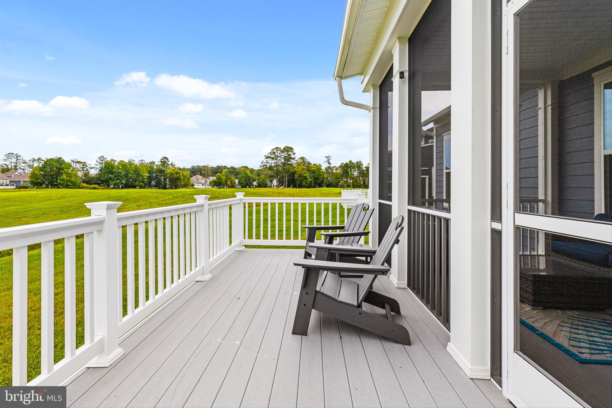 10135 Fast Colors Lane Berlin, MD 21811 - Photo 42 of 63 a view of a balcony with wooden floor and outdoor seating