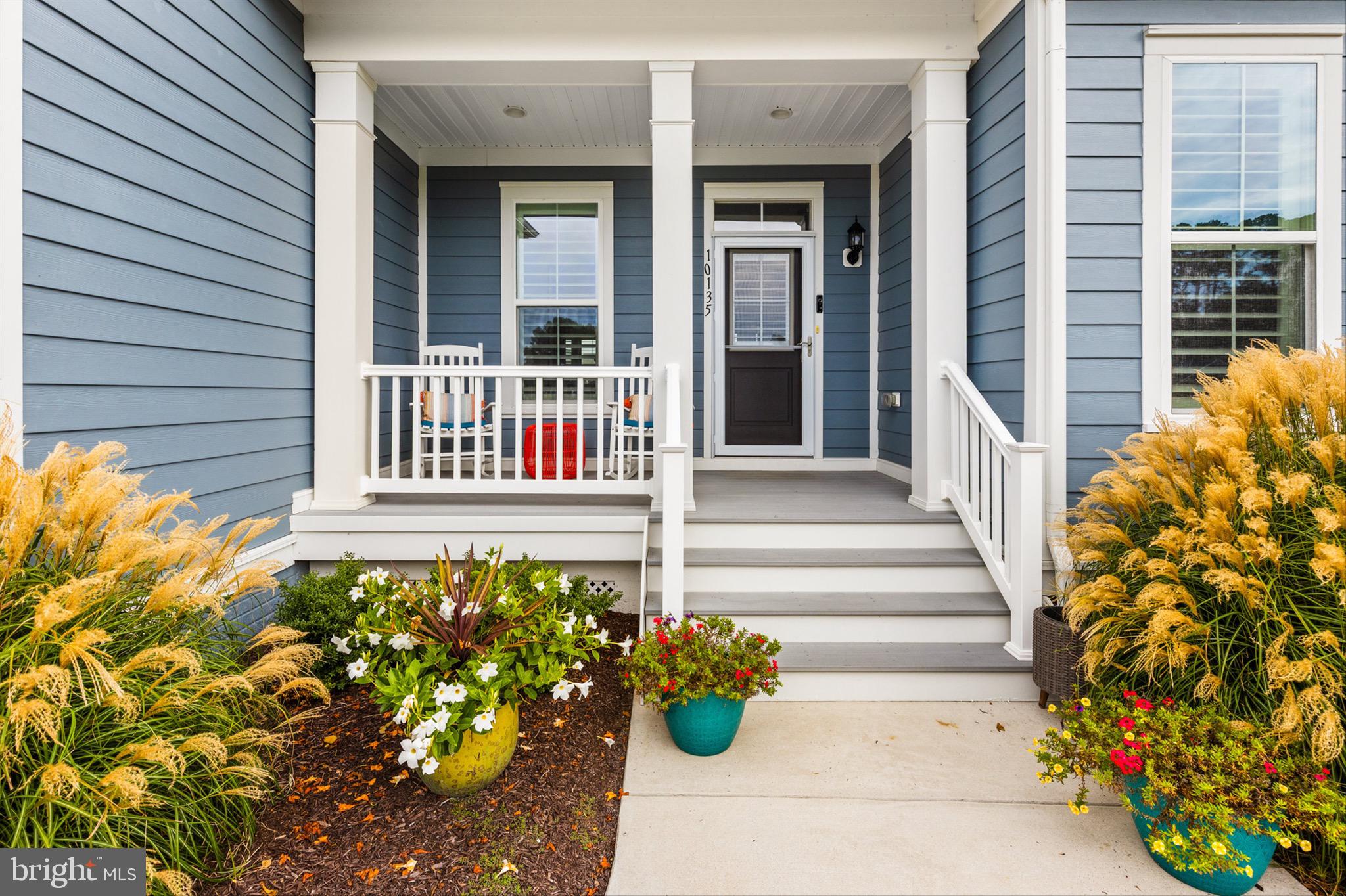 10135 Fast Colors Lane Berlin, MD 21811 - Photo 5 of 63 a view of a house with a flower garden