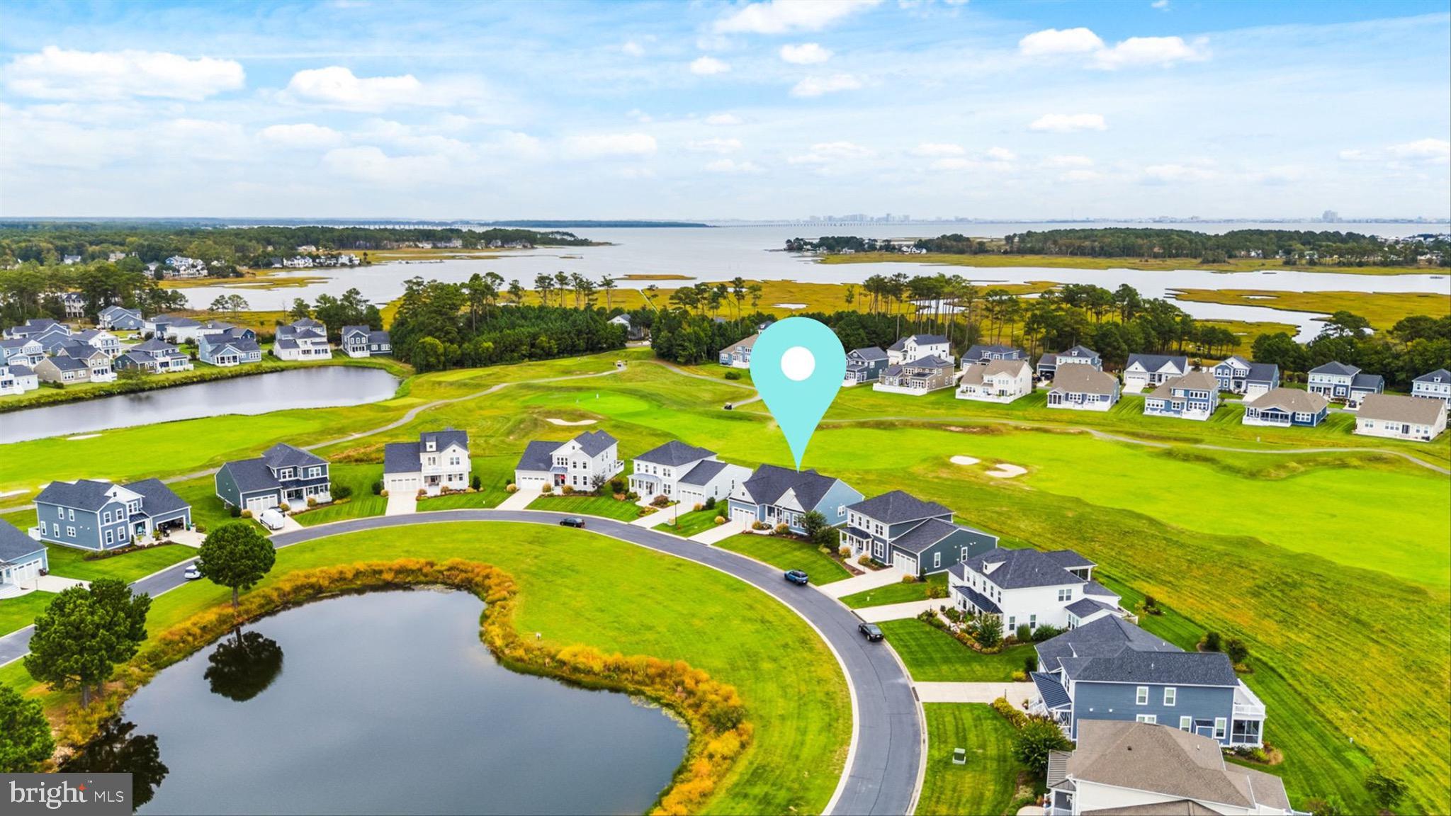 10135 Fast Colors Lane Berlin, MD 21811 - Photo 52 of 63 a view of a swimming pool with a table and chairs