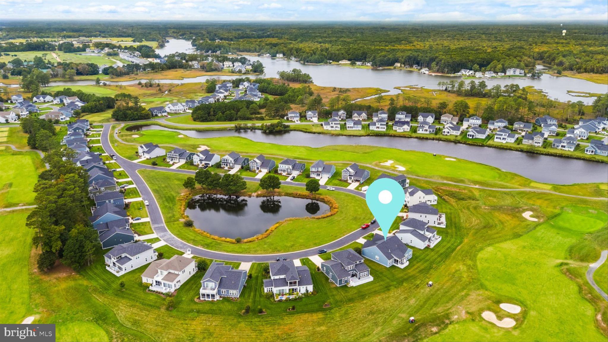 10135 Fast Colors Lane Berlin, MD 21811 - Photo 60 of 63 a view of a swimming pool with a table and chairs
