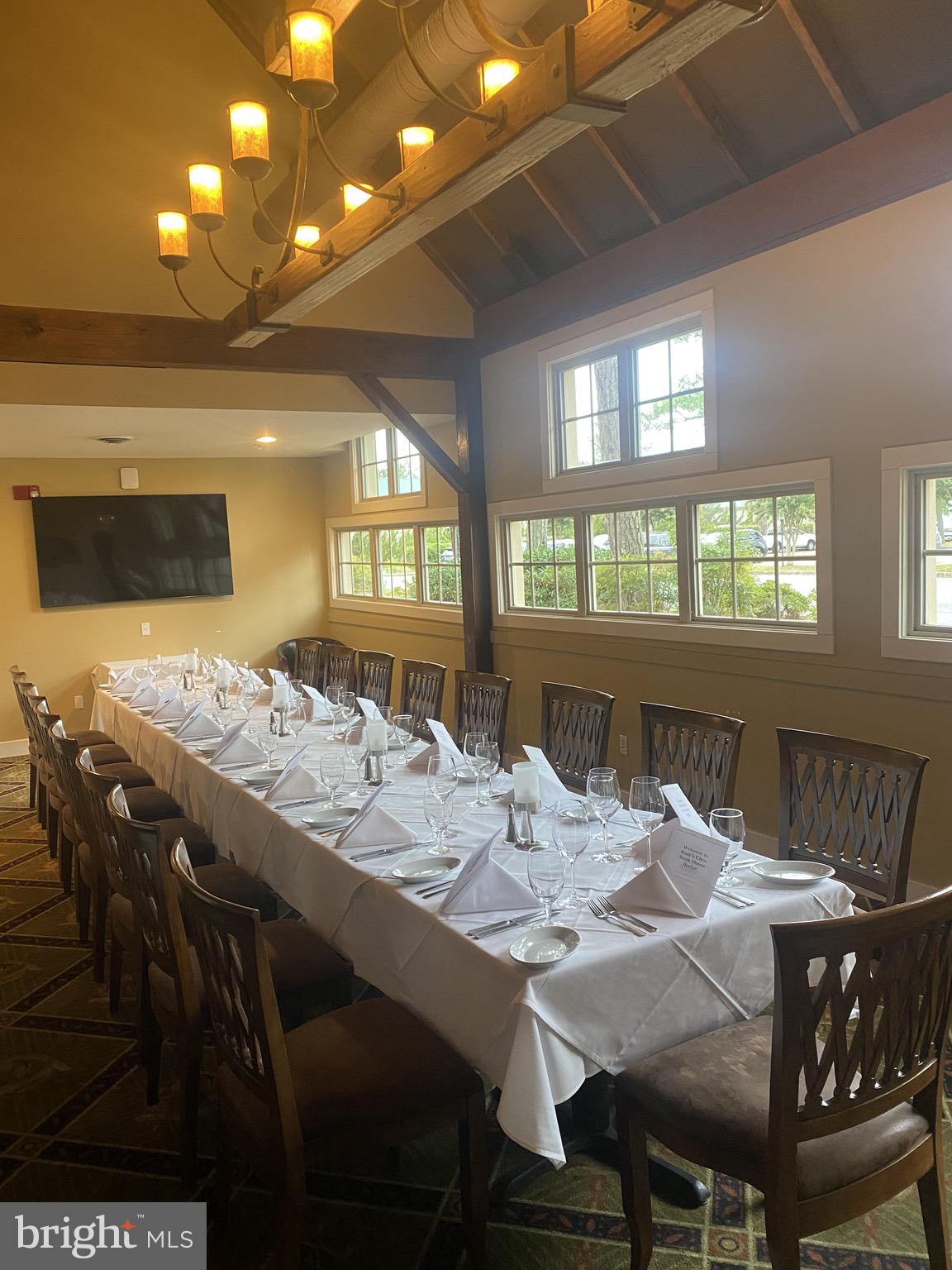10135 Fast Colors Lane Berlin, MD 21811 - Photo 63 of 63 a view of a dining room with furniture and wooden floor
