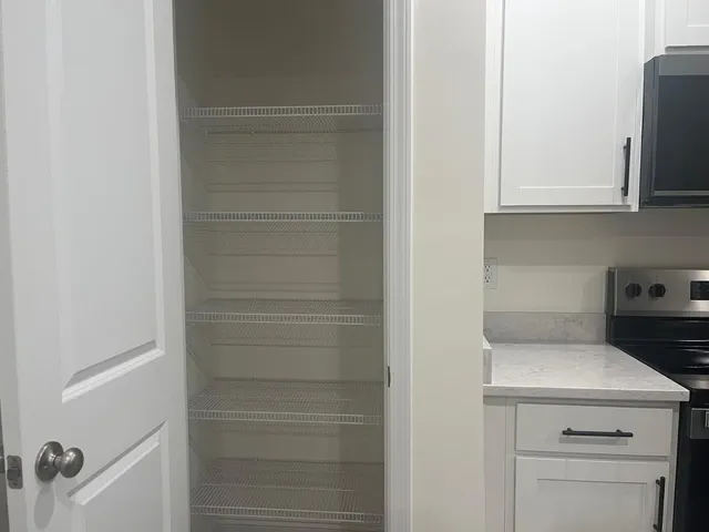 a view of storage and utility room with washer and dryer