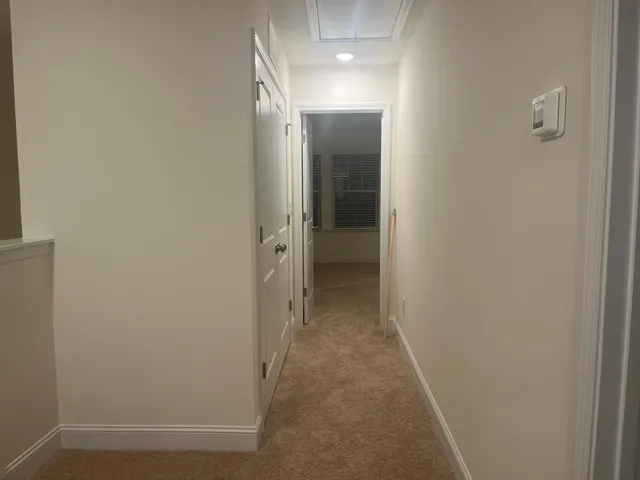 a view of a hallway with a room