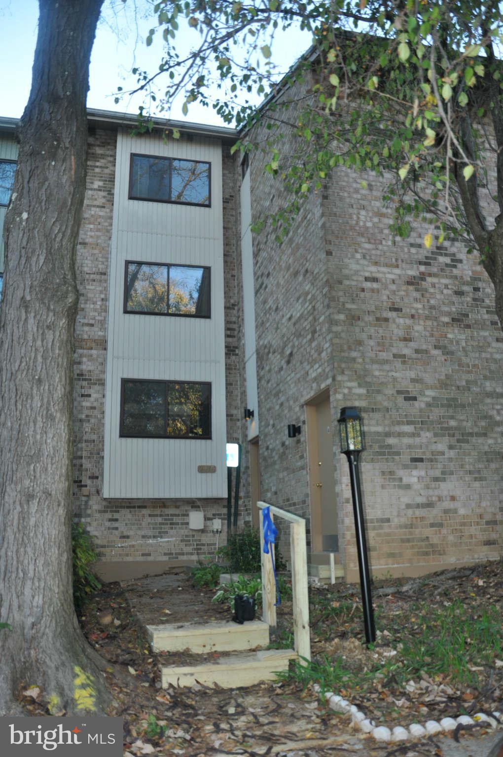 9415 Merryrest Road Columbia, MD 21045 - Photo 1 of 17 a front view of a house with a yard