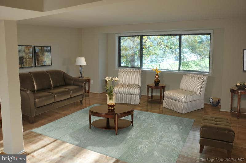 9415 Merryrest Road Columbia, MD 21045 - Photo 4 of 17 a living room with furniture and a large window