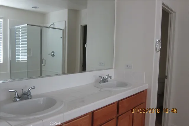 a bathroom with a sink and vanity