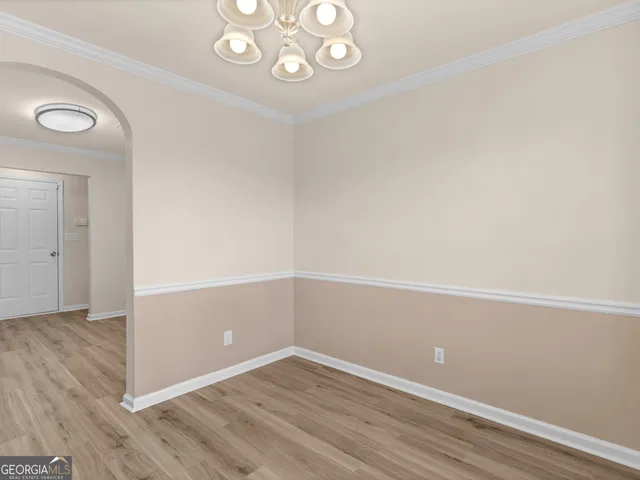 an empty room with wooden floor