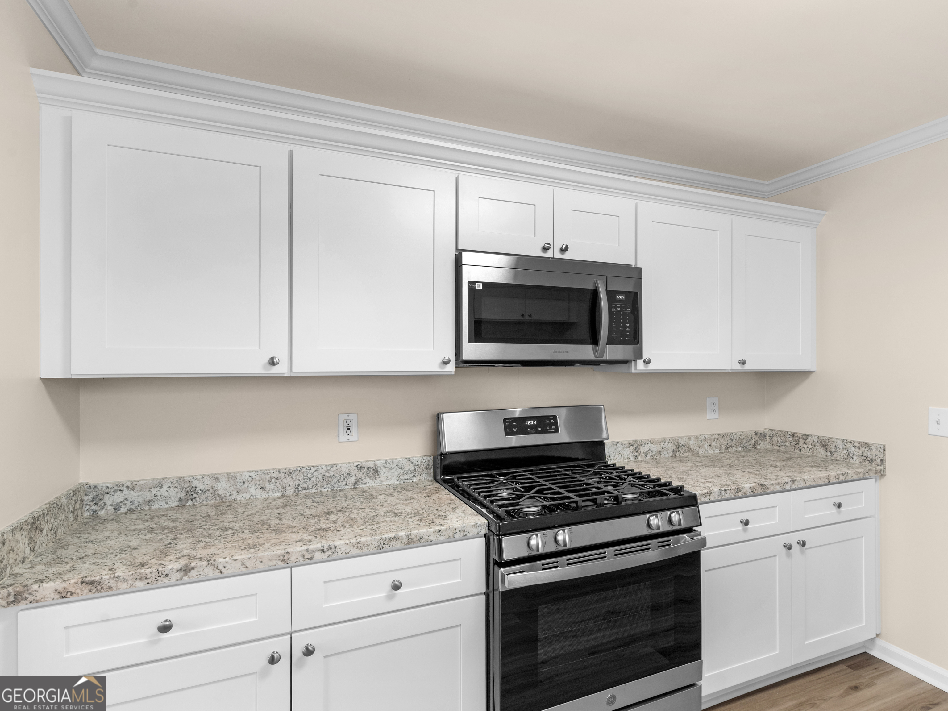 729 Old Stone Court Stockbridge, GA 30281 - Photo 14 of 47 a kitchen with granite countertop white cabinets and appliances