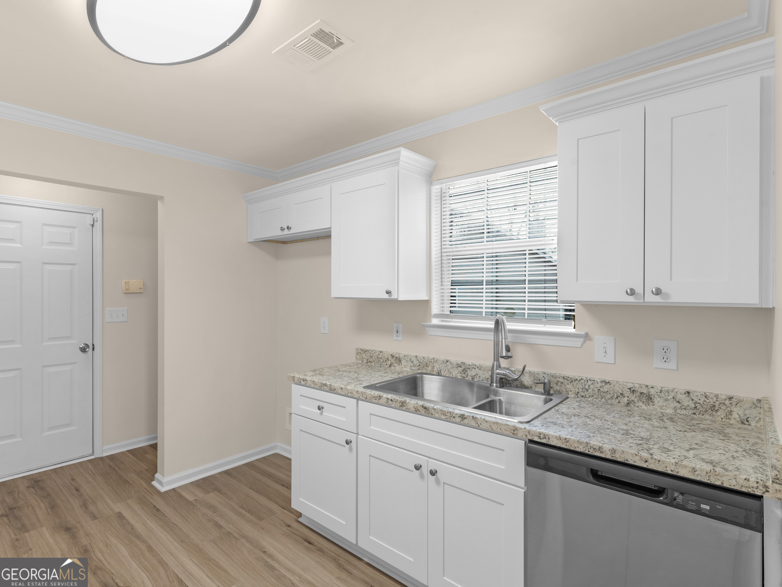 729 Old Stone Court Stockbridge, GA 30281 - Photo 16 of 47 a kitchen with a sink cabinets and window