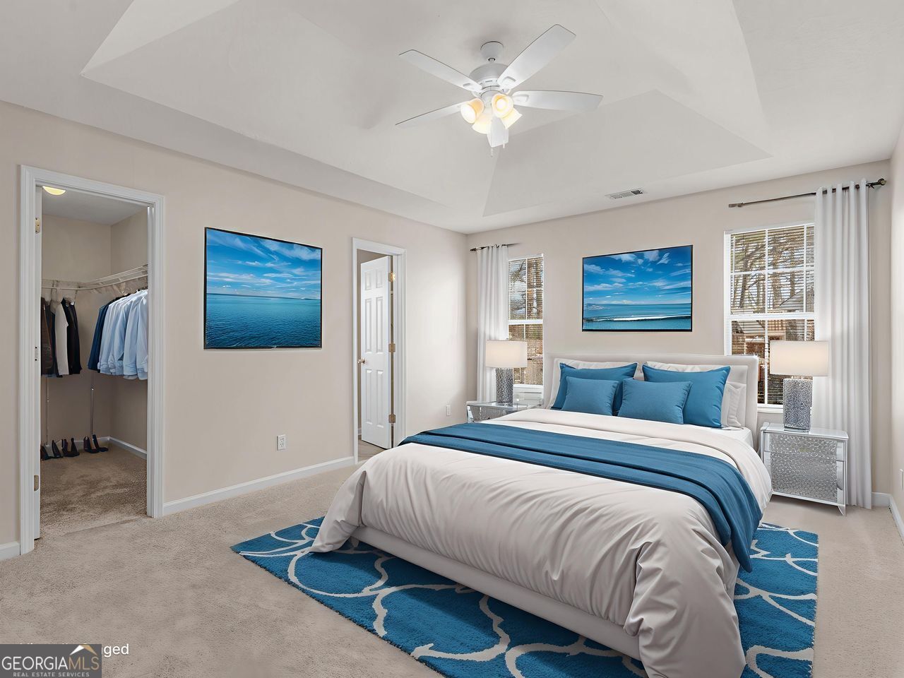 729 Old Stone Court Stockbridge, GA 30281 - Photo 20 of 47 a bedroom with a large bed and a chandelier