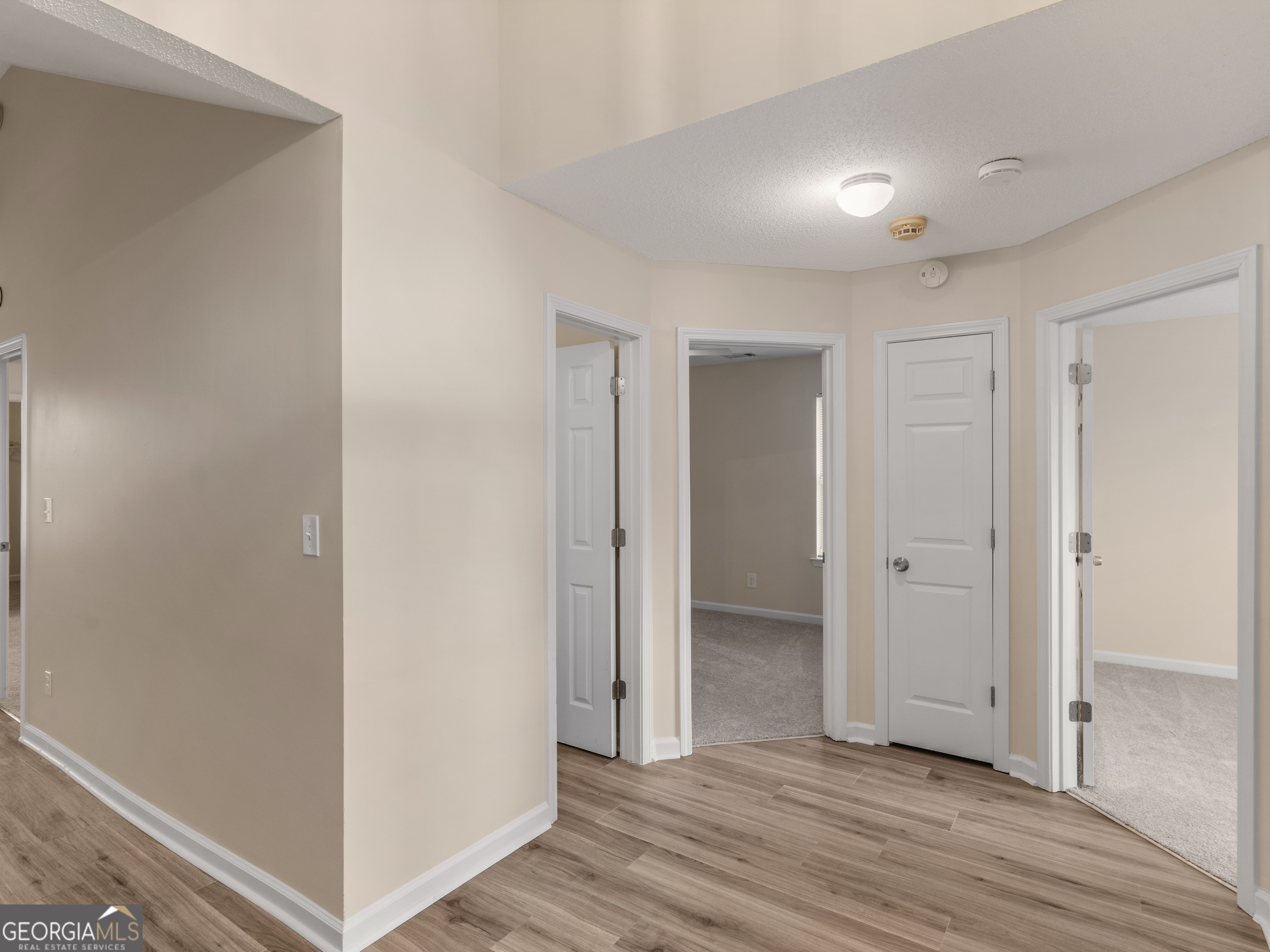 729 Old Stone Court Stockbridge, GA 30281 - Photo 3 of 47 a view of a hallway with wooden floor