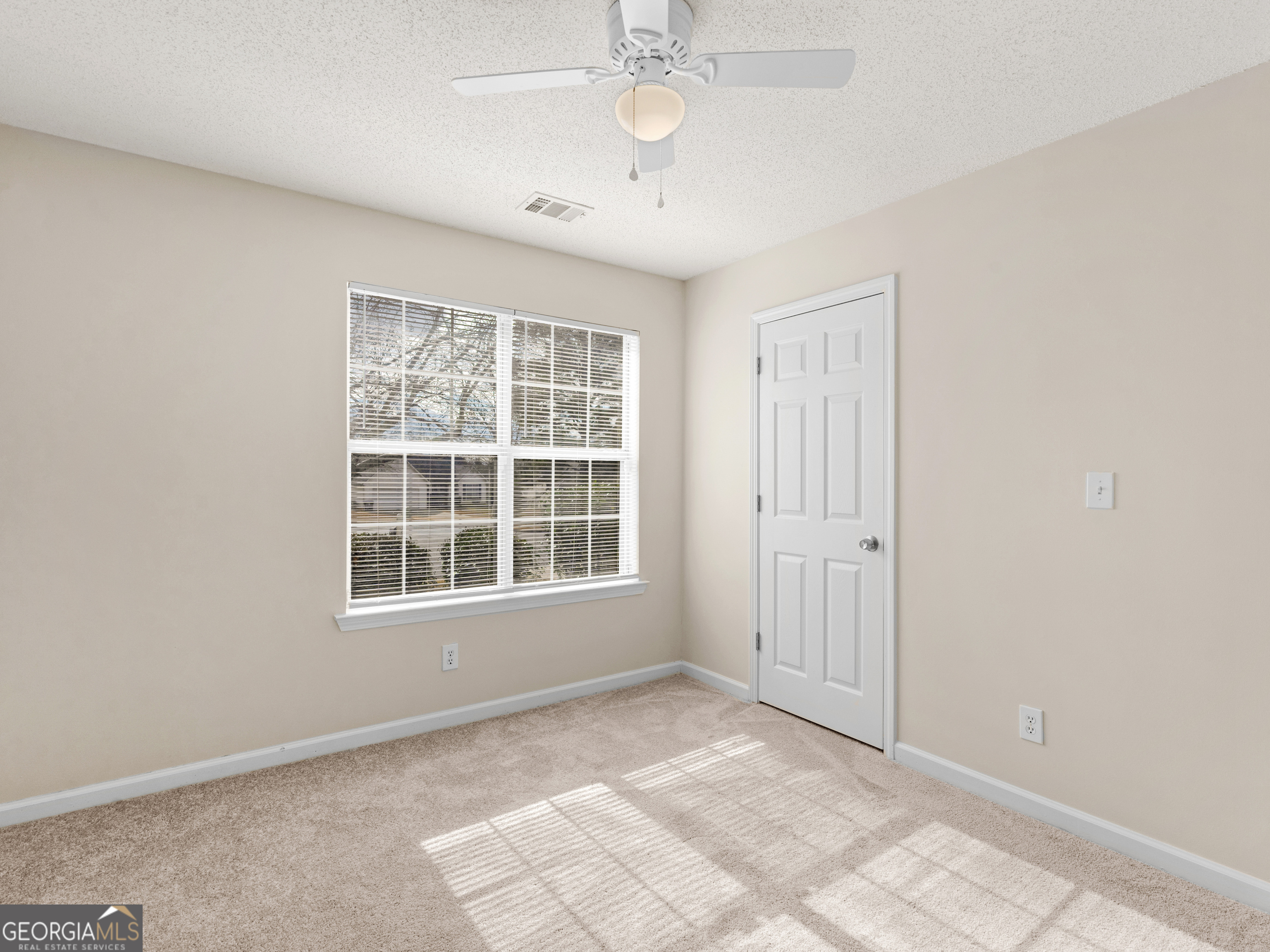 729 Old Stone Court Stockbridge, GA 30281 - Photo 32 of 47 an empty room with windows and closet