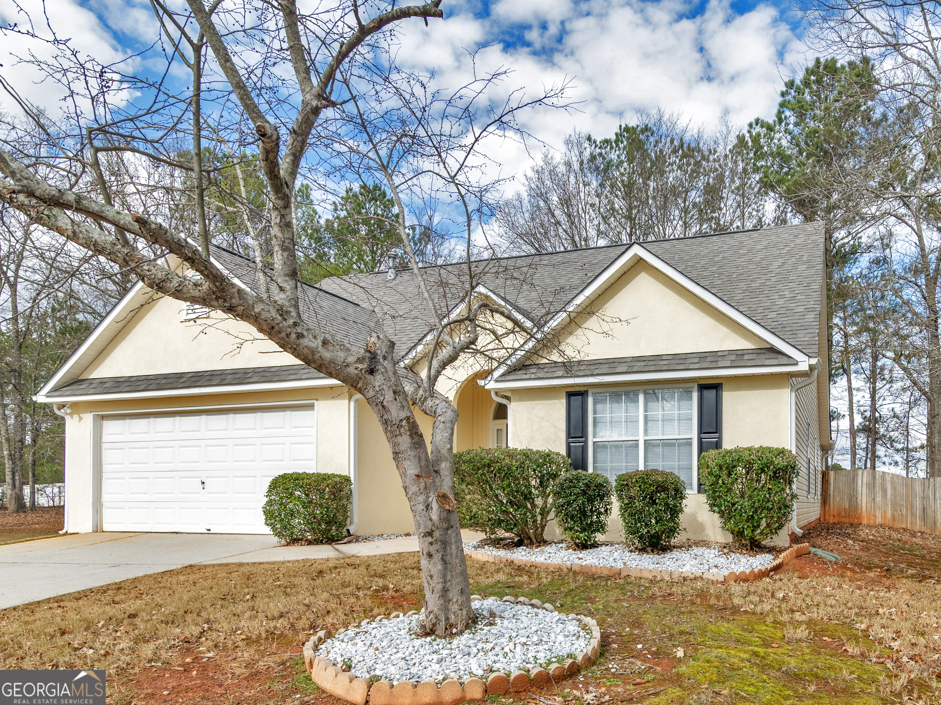 729 Old Stone Court Stockbridge, GA 30281 - Photo 44 of 47 a front view of a house with a yard
