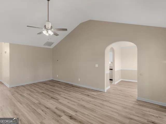 a view of an empty room with a bathroom