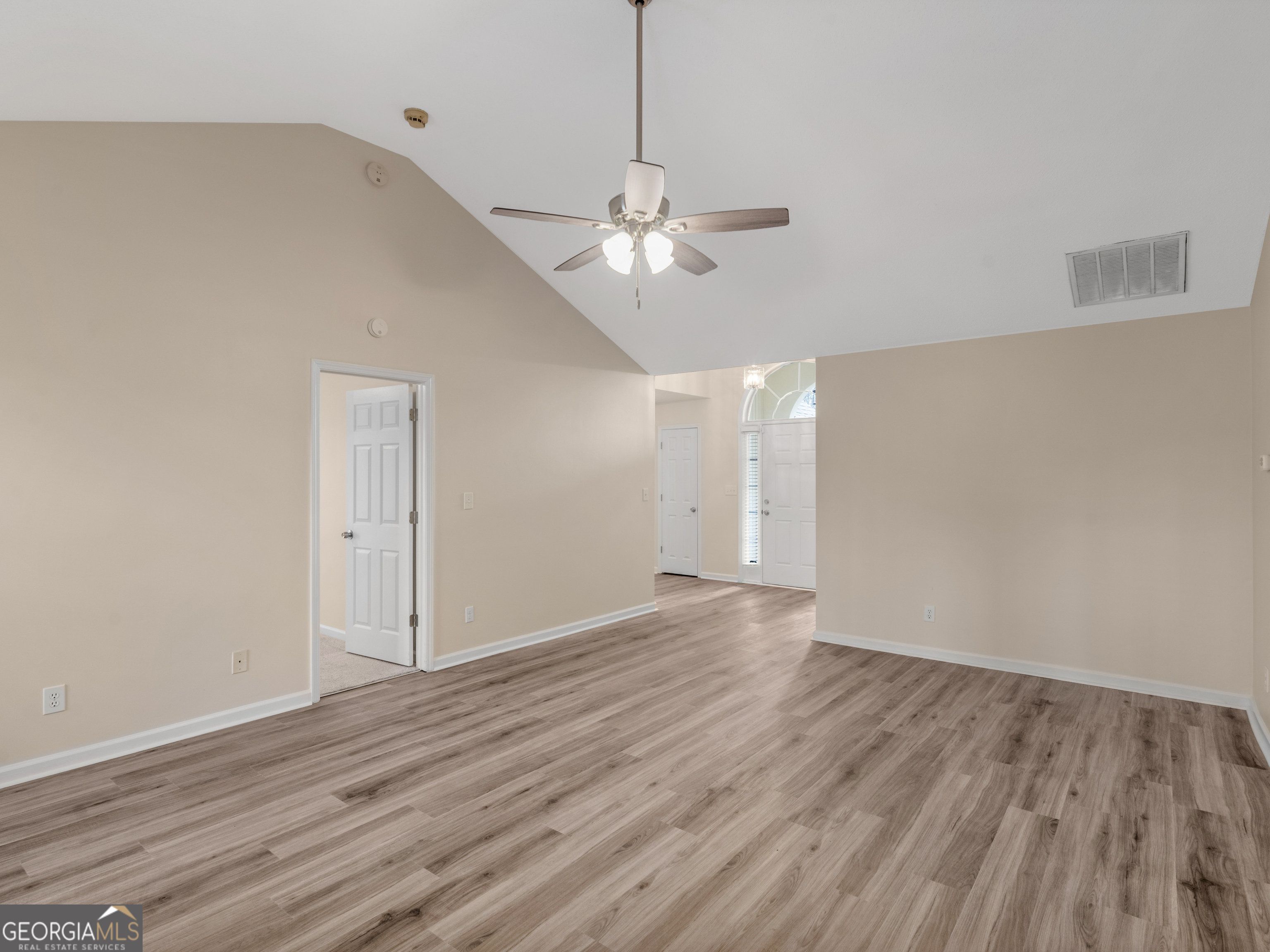 729 Old Stone Court Stockbridge, GA 30281 - Photo 8 of 47 a view of an empty room with wooden floor