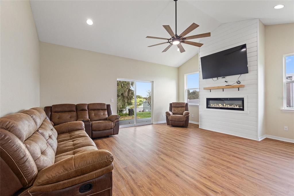 1042 Golden Bough Road Lake Wales, FL 33898 - Photo 15 of 53 a living room with furniture and a flat screen tv