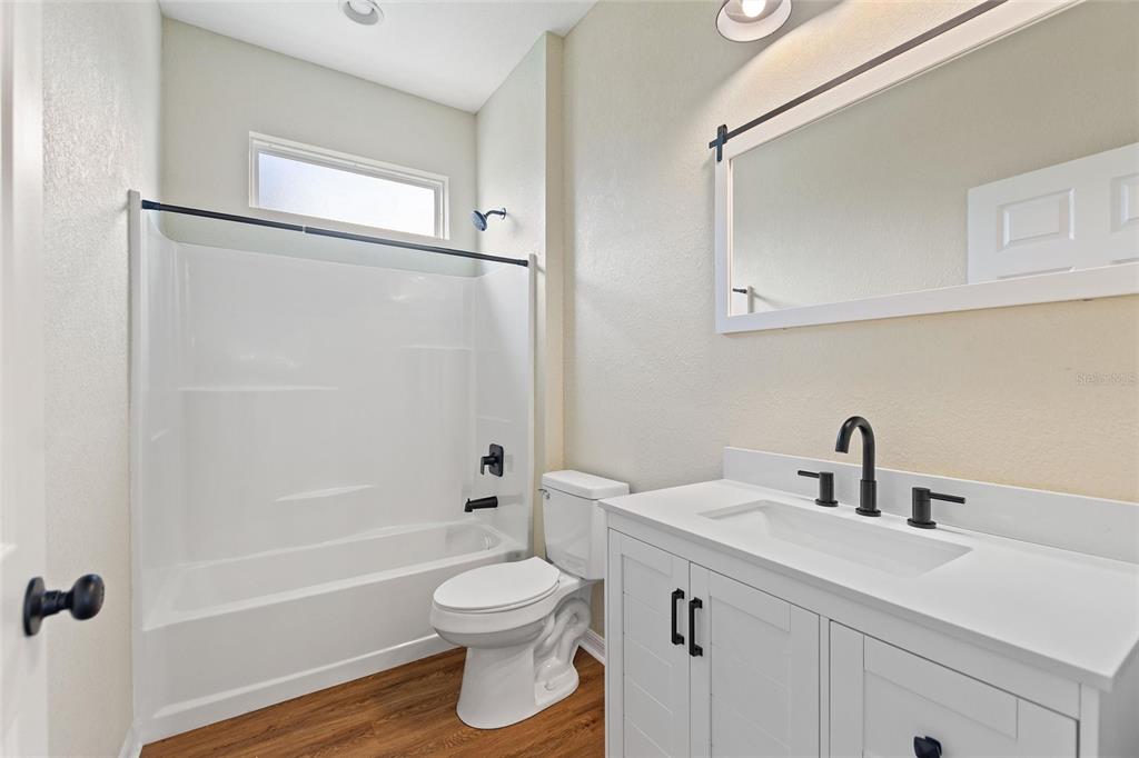 1042 Golden Bough Road Lake Wales, FL 33898 - Photo 20 of 53 a bathroom with a sink toilet and shower