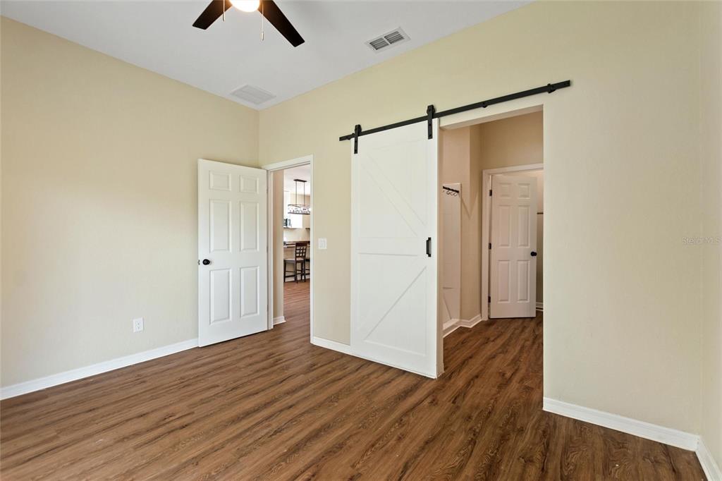 1042 Golden Bough Road Lake Wales, FL 33898 - Photo 23 of 53 a view of an empty room with wooden floor