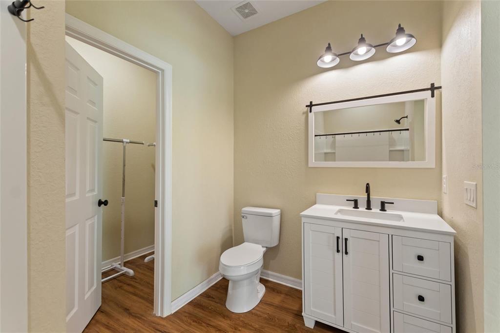 1042 Golden Bough Road Lake Wales, FL 33898 - Photo 25 of 53 a bathroom with a toilet sink and mirror