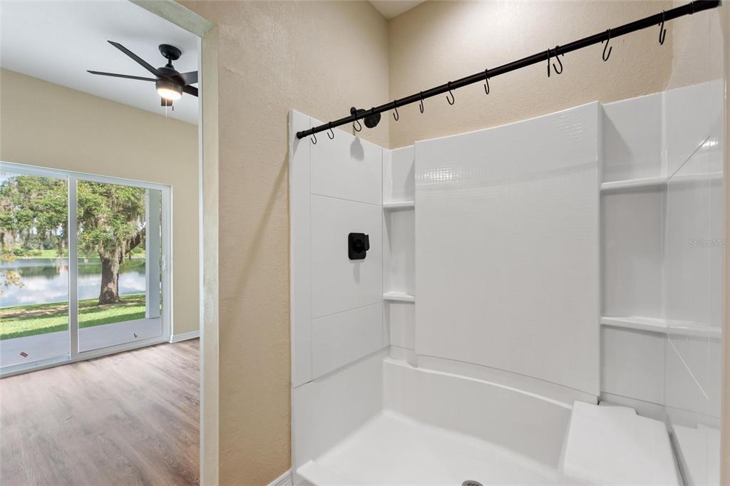 1042 Golden Bough Road Lake Wales, FL 33898 - Photo 26 of 53 a bathroom with a shower and a tub