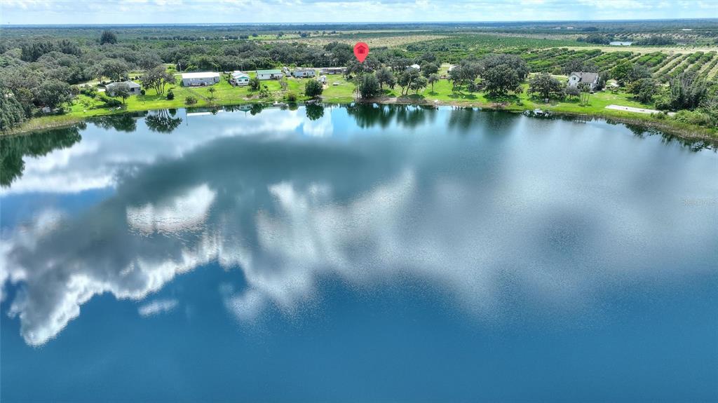 1042 Golden Bough Road Lake Wales, FL 33898 - Photo 35 of 53 a view of a lake with houses
