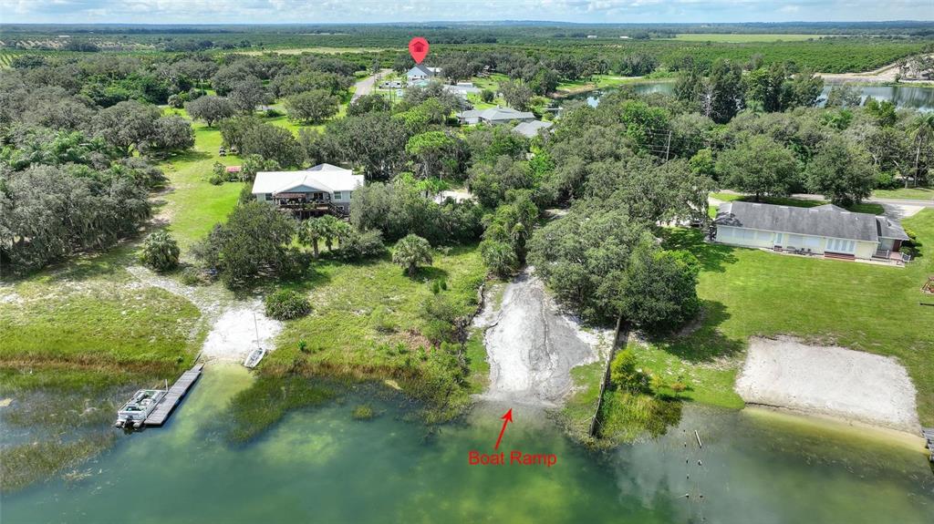 1042 Golden Bough Road Lake Wales, FL 33898 - Photo 37 of 53 a view of a garden with a lake view