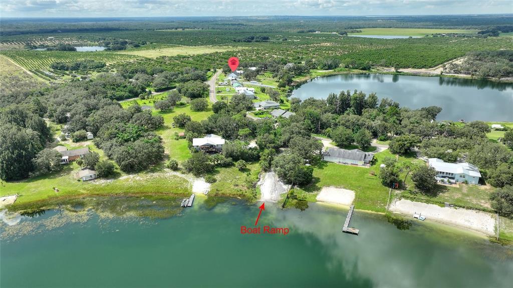 1042 Golden Bough Road Lake Wales, FL 33898 - Photo 38 of 53 a view of a lake with a yard
