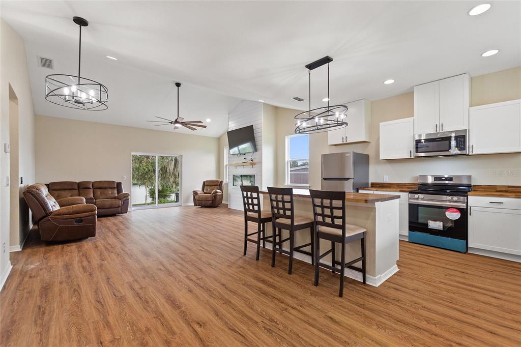 1042 Golden Bough Road Lake Wales, FL 33898 - Photo 9 of 53 a view of a dining room with furniture window and wooden floor