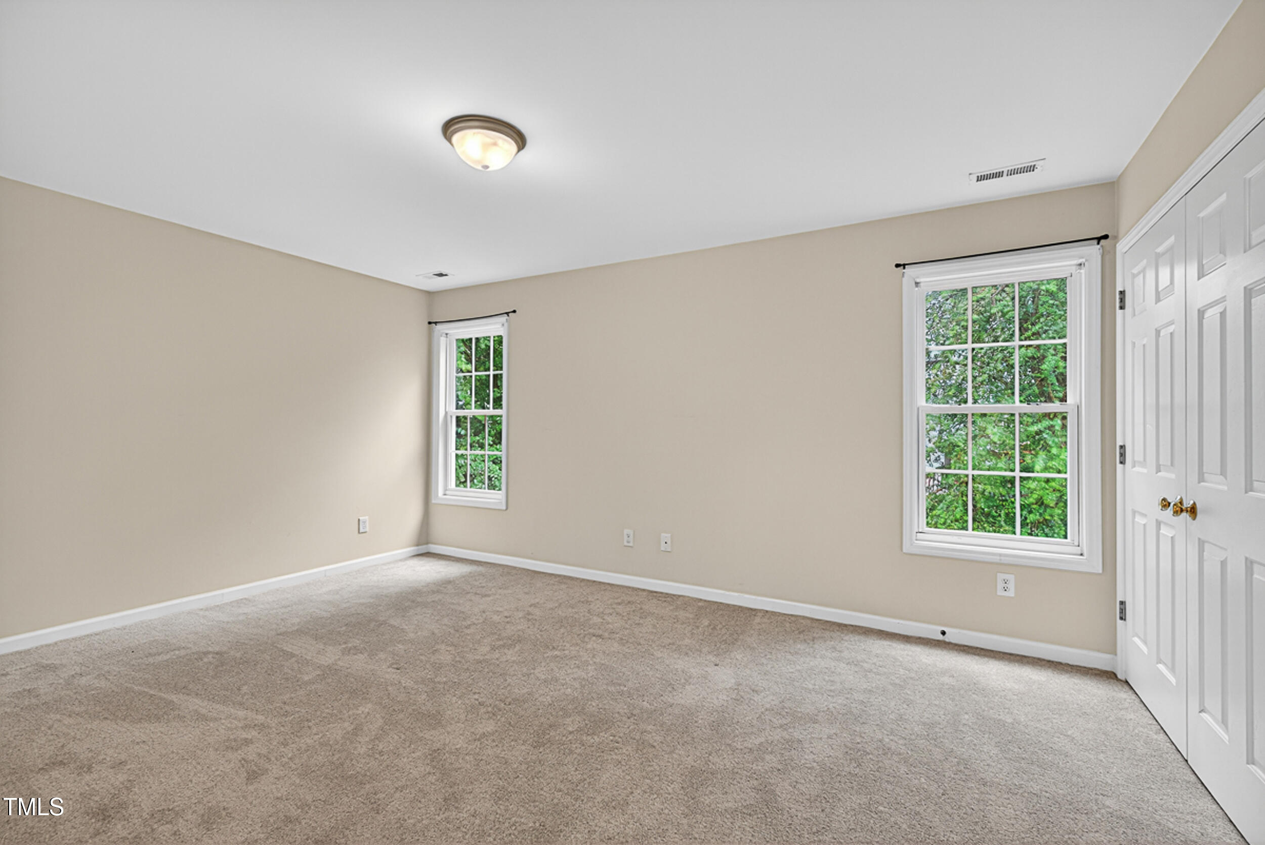 2407 Trout Stream Drive Raleigh, NC 27604 - Photo 15 of 26 an empty room with windows and closet